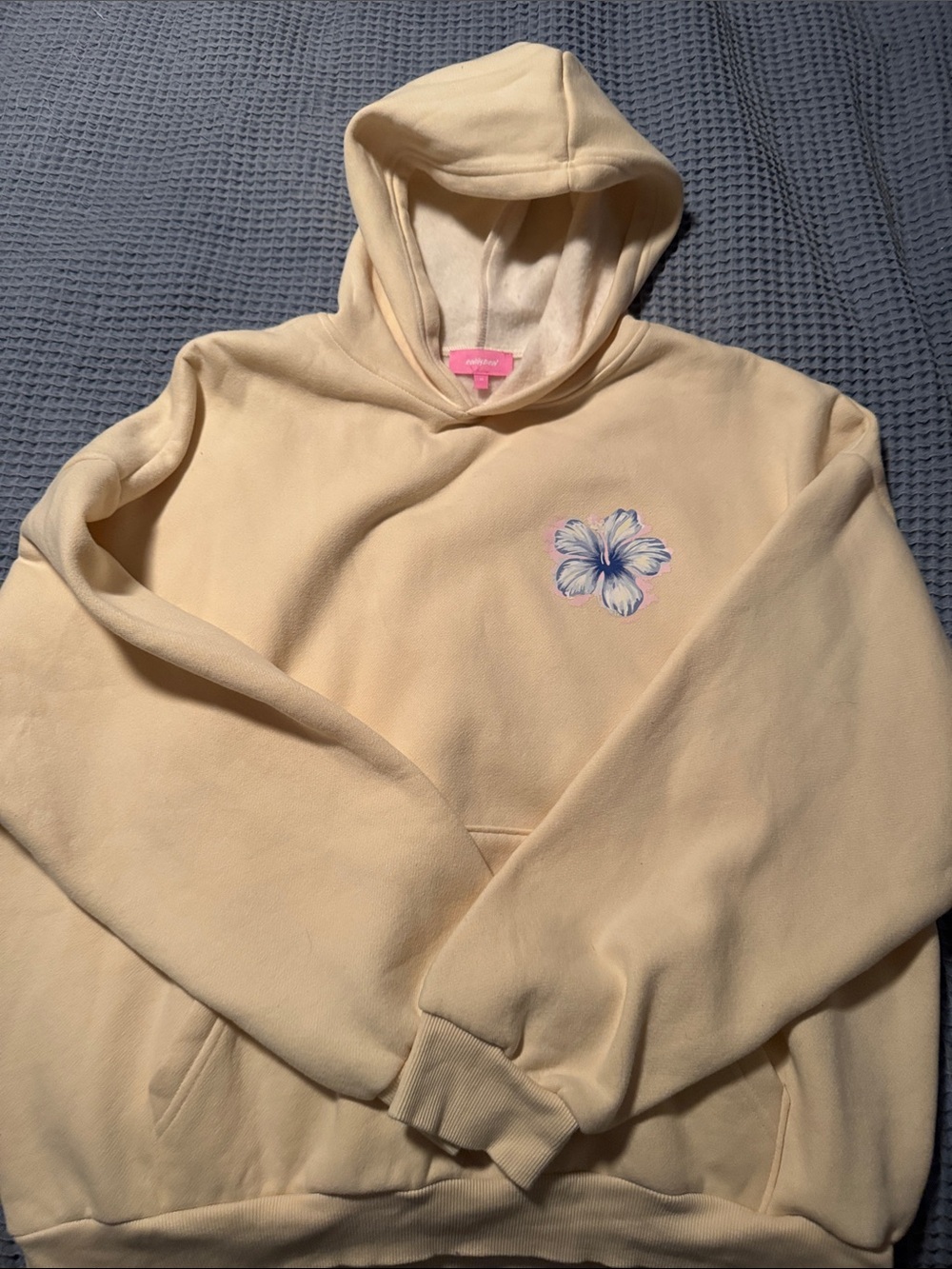 Edikted Butter yellow Hooded Sweatshirt with Delicate Blue-Pink Floral Motif